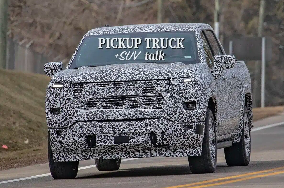 2027 GMC Sierra 1500 prototype in camouflage on public road